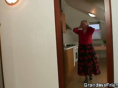 Very old blonde granny satisfies two workers