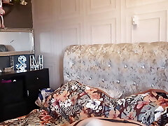 Housewife getting into Her lingerie for Her Husband coming home