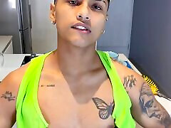 Slim tattooed boy gets a handjob to his big dick