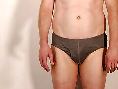 Jonathan pissing his underwear and pisses over his naked body as he masturbates rubbing the pee over his chest and erection