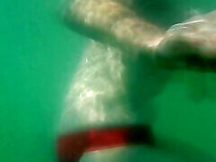 My tits underwater on public beach