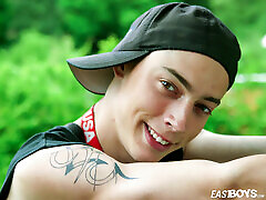 Slim boy shows off his body and cock in the garden