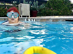 Couple Underwater Diving and Swimming