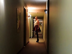 Sissy Ray in Hotel Corridor in Purple Maids Uniform