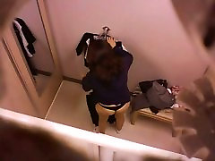 Brunette asian in black thongs changing clothes spy video