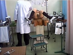 Lovely Japanese gets her pussy toyed during a eroti female exam