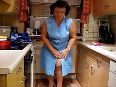 German granny trying on aprons