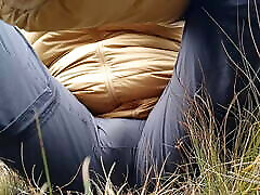 Pissing on the grass outdoors
