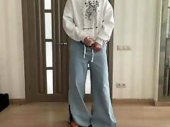 Sissy in wide leg palazzo bootcut flared jeans and white hoodie on high heels ready for the evening dancing and cum
